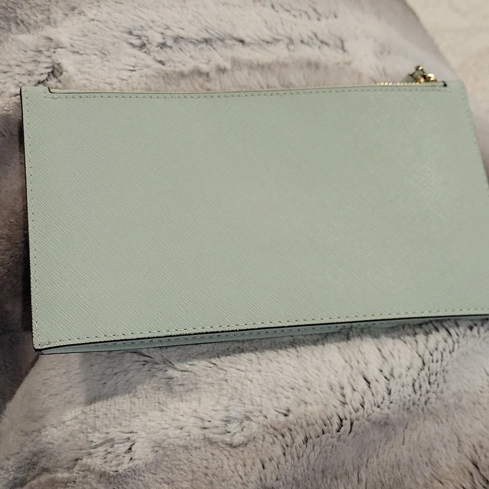 kate spade mint green wristlet clutch with gold logo